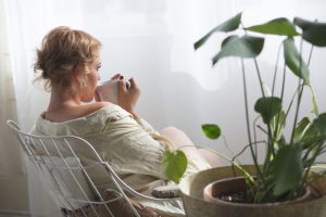 picture of a woman sipping spearmint tea thinking about lean PCOS