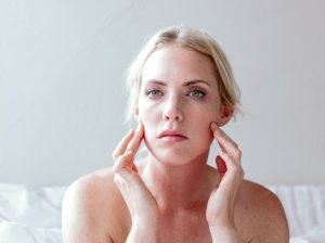 picture of a woman with pcos acne on her chin and jawline