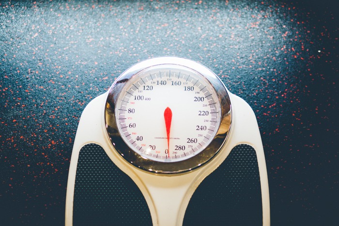 picture of a scale to weight yourself with pcos weight gain, pcos belly fat, and to lose weight with pcos